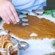 Making gingerbread cookies. Child cuts big star with Christmas mold on table - VideoHive Item for Sale