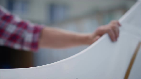 Pilot Hand Touching Airplane Wing for Flight Close Up