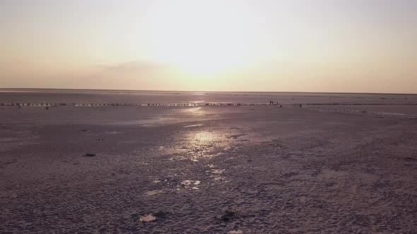 Beach with Pink Salt Shot From Above in the Evening on the Sunset. Aerial View