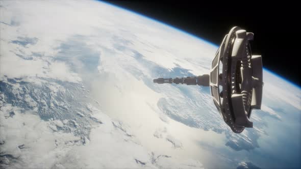 Futuristic Space Satellite Orbiting the Earth alt