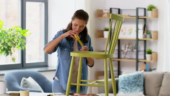 Woman with Ruler Measuring Chair for Renovation