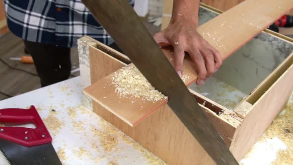 Carpenter Working on Wood Craft at Workshop