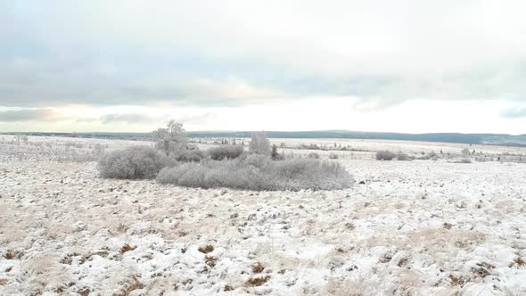 Magical winter moorland in ascending drone shot