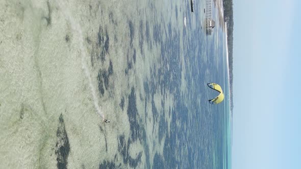 Vertical Video Kitesurfing Near the Shore of Zanzibar Tanzania Aerial View