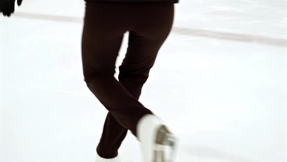 Woman Practicing Spins on Ice Rink