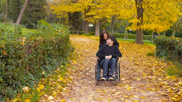 Invalid Young Man Having Fun with His Girfriend in The Park