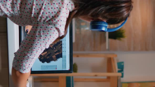 Vertical Video Architect with Headset Using Laptop Working at Home