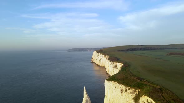 Aerial forward over high cliffs of Old Harry Rocks on Purbeck island, Dorset. UK