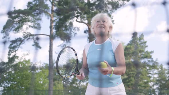 Successful Happy Mature Woman Won the Tennis Tournament