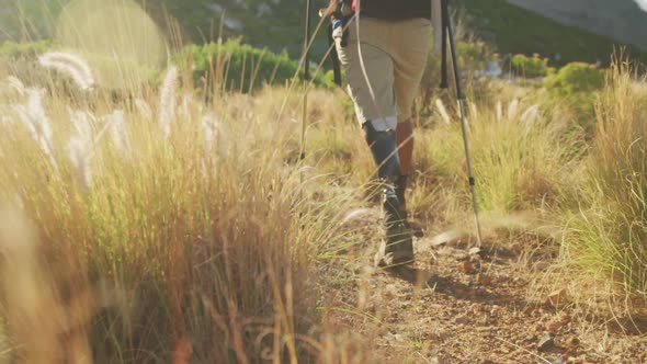 Mixed race man with prosthetic leg hiking in nature