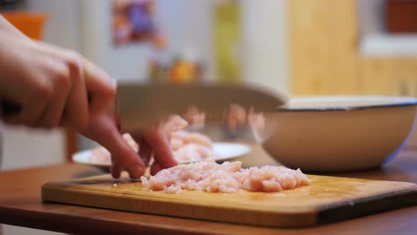 Hands Cutting Fresh Meat, Cutting Meat on a Kitchen Board, Cutting Raw Meat