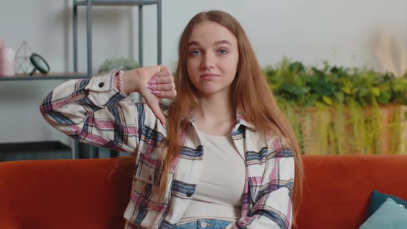 Teen Girl Showing Thumbs Down Sign Gesture Expressing Discontent Disapproval Dissatisfied Dislike