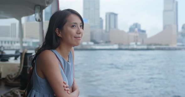 Woman visit Hong Kong city and take the ferry 