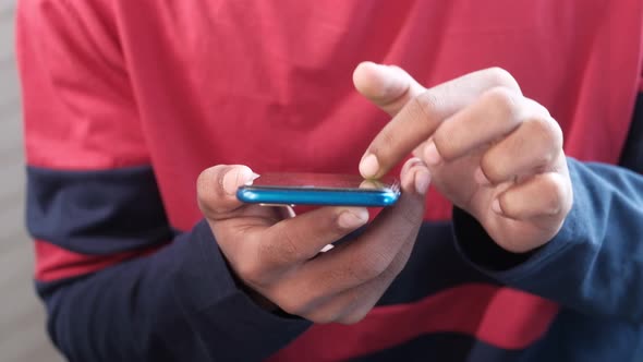 Young Man in Casual Dress Using Smart Phone