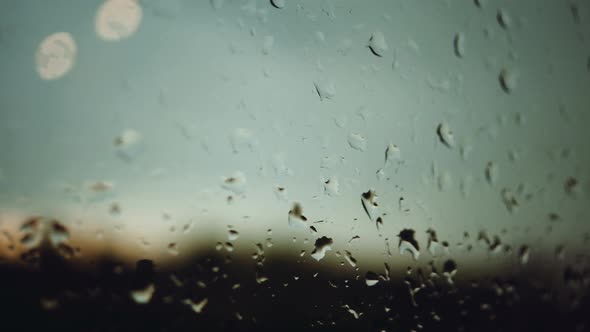 drops of water on the window. camera movement along wet glass on a rainy day