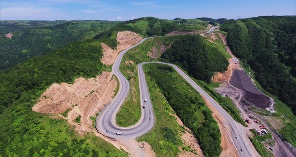 Aerial View of the Landscape of a Winding Curved Road in the Green Mountains
