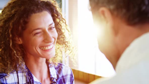 Couple interacting with each other in supermarket