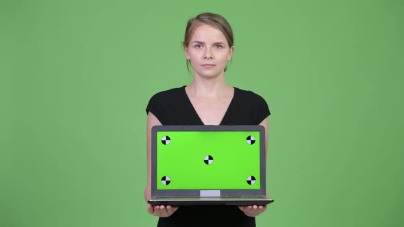 Young Happy Businesswoman Showing Laptop