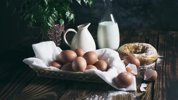 Still Life with Eggs and Milk on Wooden Boards