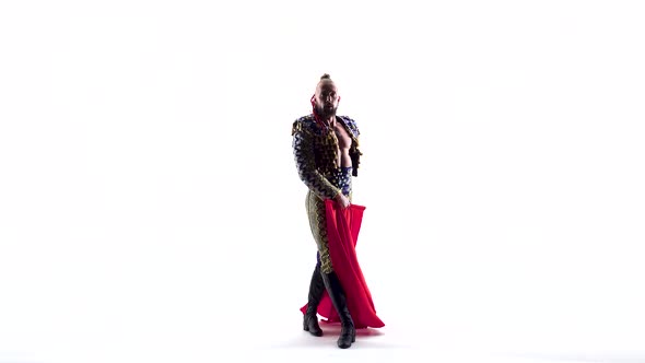 Handsome Toreador in Black Costume with Red Clothisolated Over White Studio Background