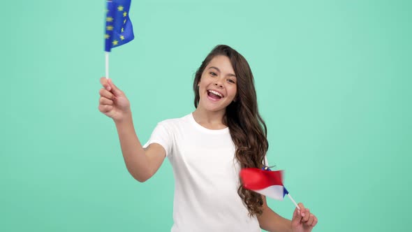 Happy Child Waving European Union and French Flag on Blue Background France Vacation