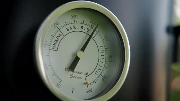 Close Up View of The Smokehouse Door Closed with a Thermometer