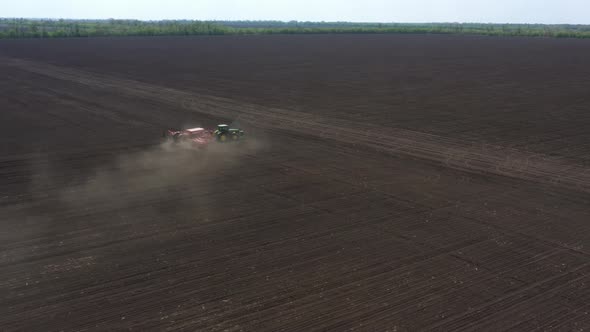 Working At The Field Tractor With The Seeder 21