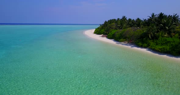 Luxury fly over island view of a summer white paradise sand beach and blue water background in vibra