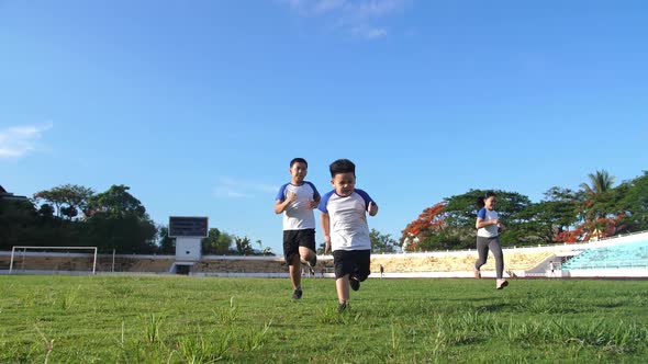 Happy Children Running At Stadium