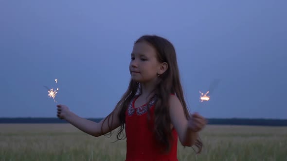 Portrait of a Girl with Sparklers in Their Hands at Evening.