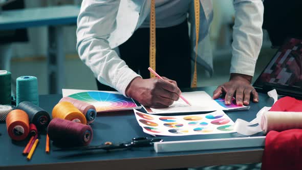 A Designer is Drawing a Piece of Clothes