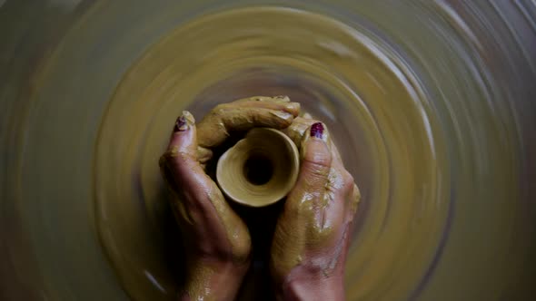 Close Upper Girl Shapes Round Ceramic Vase on Pottery Wheel