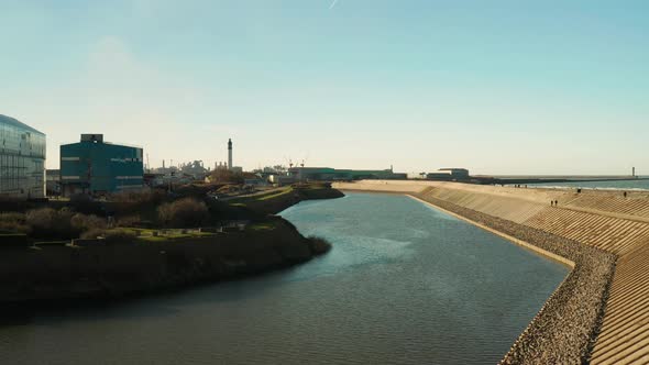 Dunkirk sea dike, lighthouse and factories (Dunkerque, France)