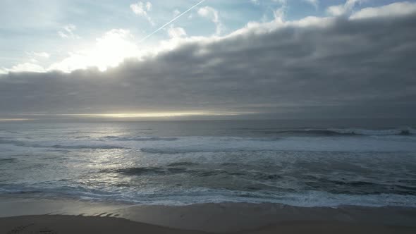 Beautiful Rain Cloud At Sunset Over Sea Water