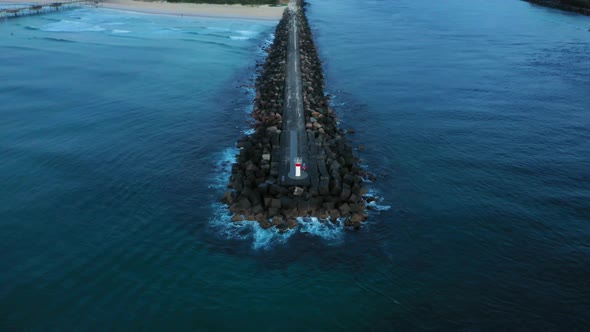 Slow descent, Gold Coast Seaway rockwall, sunrise