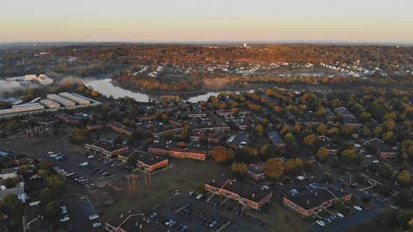 A Small Residential Area Near the River Was Enveloped in Autumn Fog in the Early Morning