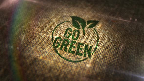 Go green and eco friendly symbol sign stamp on linen sack