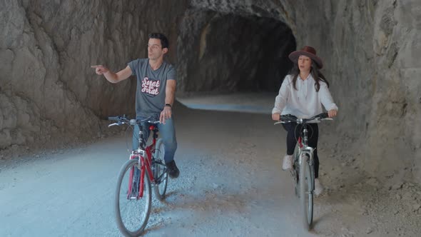 Tourist Couples Cycling on Stone Road