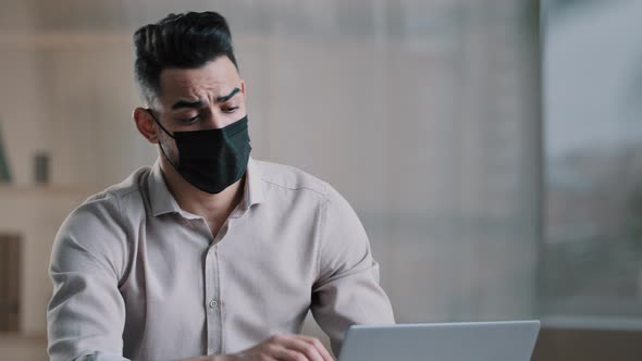 Tired Sick Hispanic Overwhelmed Young Male Stressed Businessman in Medical Mask Feel Fatigue