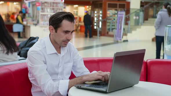 Smart Man Working Hard with Laptop