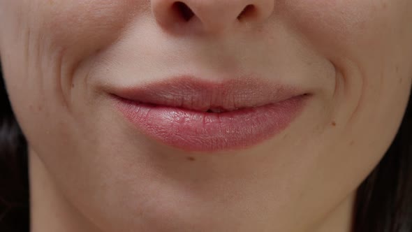 Macro Shot Portrait of Cheerful Woman Smiling in Front of Camera