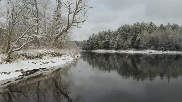 Winter on Piscataquis river. Maine. USA. Aerial forward