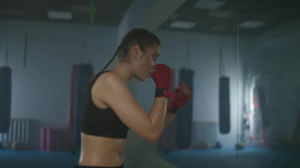 Woman Power Caucasian Female Fighter Trains His Punches and Defense in the Boxing Gym a Boxer Trains