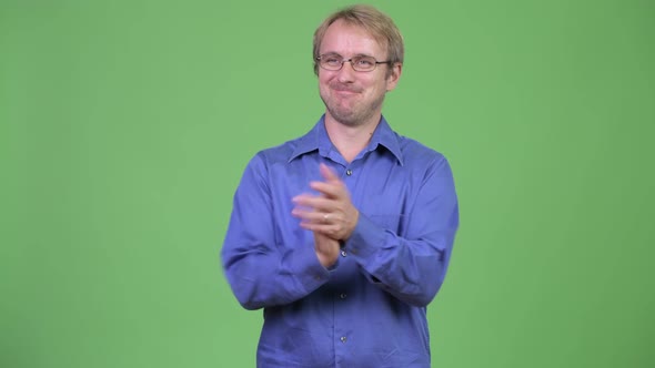 Happy Handsome Blonde Businessman Clapping Hands