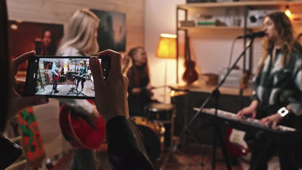 Recording Video Of All-Girl Music Band Playing