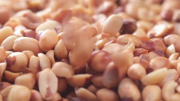 Close Up of Dropping Processed Pea Nuts in a Bowl