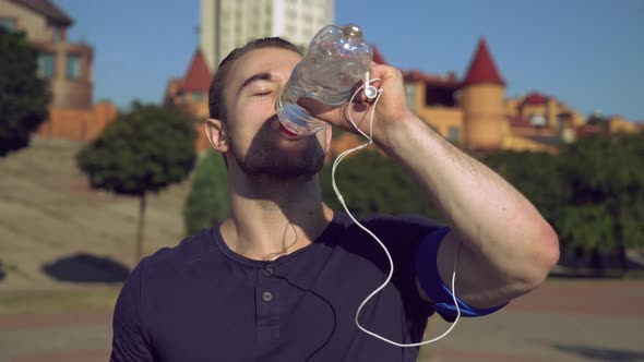 Guy Enjoy Drink After Exercises Outdoors