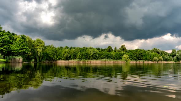 Calm lake in green city park.