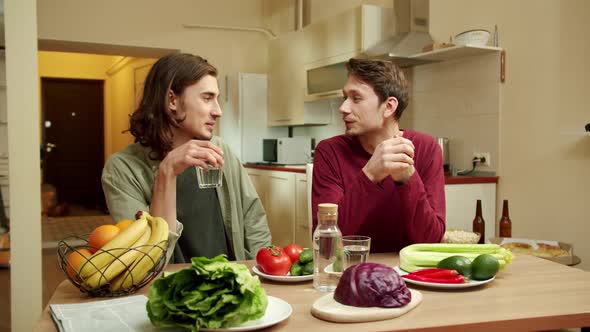 Two Men are Talking and Looking to Each Other