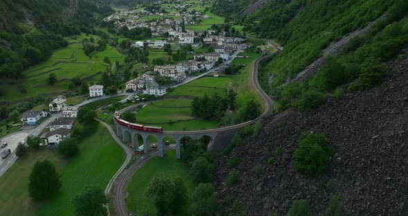 The Bernina Express Ttrain passes over the helical Brusio viaduct. Filmed in high quality with DJI M